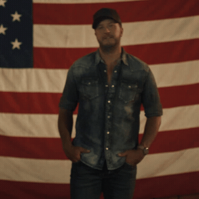 Man Standing In Front Of American Flag GIF