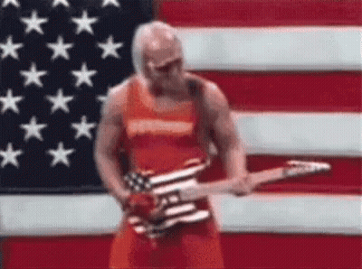 Man Standing In Front Of American Flag Playing Guitar GIF
