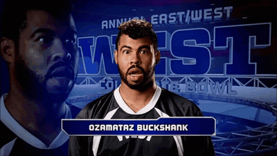 Man Standing In Front Of Annual East West Bowl Sign GIF