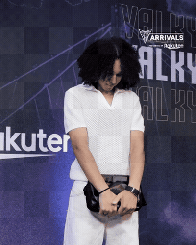 Man Standing In Front Of Arrivals Sign GIF