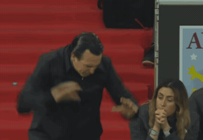 Man Standing In Front Of AV Sign GIF