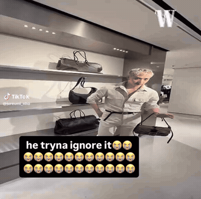 Man Standing In Front Of Bags Saying He Tryna Ignore It GIF