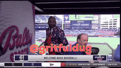 Man Standing In Front Of Ballpark Saying Welcome Back Baseball GIF