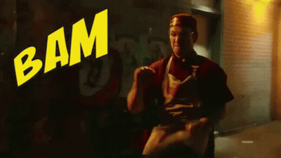 Man Standing In Front Of Bam Sign GIF