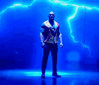 Man Standing In Front Of Blue Lightning Strike GIF