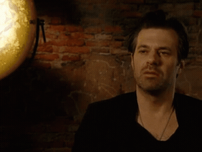 Man Standing In Front Of Brick Wall Says Echt Fantastisch GIF