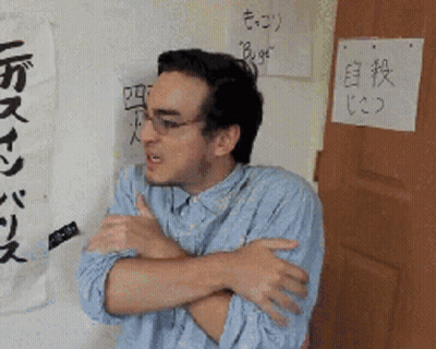 Man Standing In Front Of Bugs Sign GIF