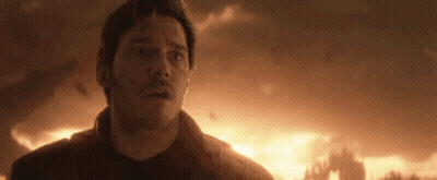 Man Standing In Front Of Burning Building GIF