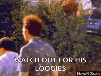 Man Standing In Front Of Bush Saying Watch Out For His Loogies GIF
