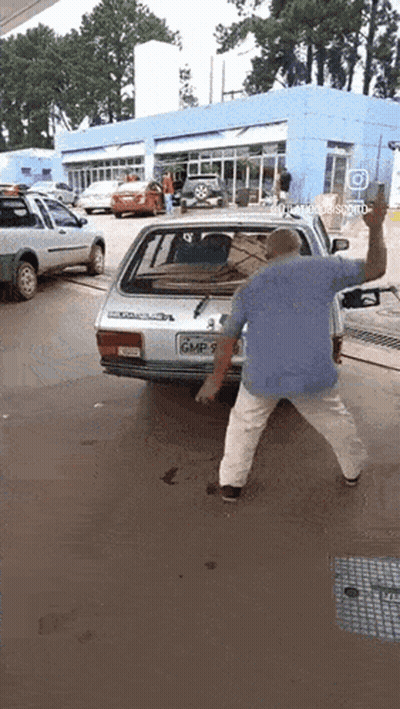 Man Standing In Front Of Car With License Plate GMP 7 GIF