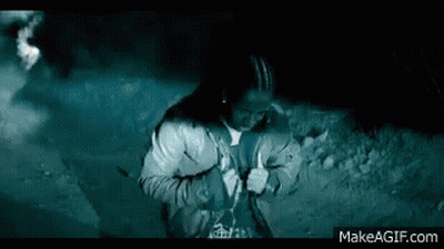 Man Standing In Front Of Car With Lights On GIF
