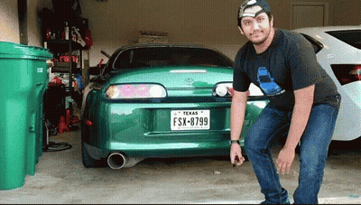 Man Standing In Front Of Car With Texas License Plate GIF