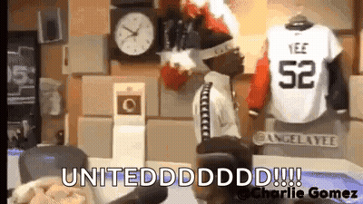 Man Standing In Front Of Clock And Jersey 52 GIF