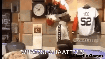 Man Standing In Front Of Clock Next To Jersey Saying What GIF