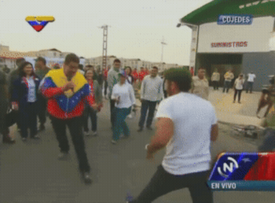 Man Standing In Front Of Cojedes Building GIF