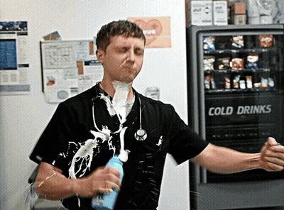 Man Standing in Front of Cold Drinks Machine
