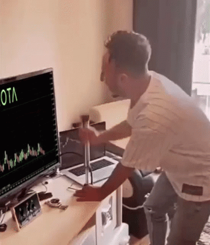 Man Standing In Front Of Computer Graph GIF