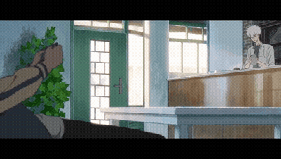 Man Standing In Front Of Counter With Green Door GIF