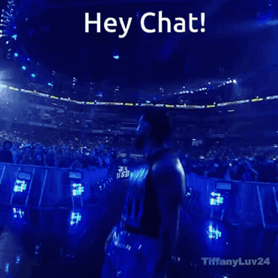 Man Standing In Front Of Crowd Saying Hey Chat GIF