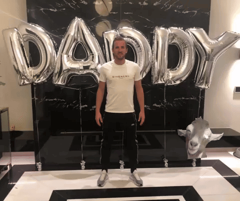 Man Standing In Front Of Daddy Balloons GIF
