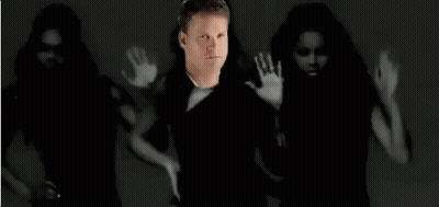 Man Standing In Front Of Dancing Women Black And White Photo GIF