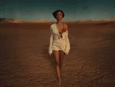 Man Standing In Front Of Desert Explosion GIF