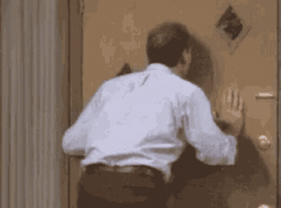 Man Standing In Front Of Door GIF