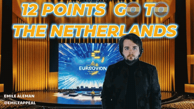 Man Standing In Front Of Eurovision Screen GIF