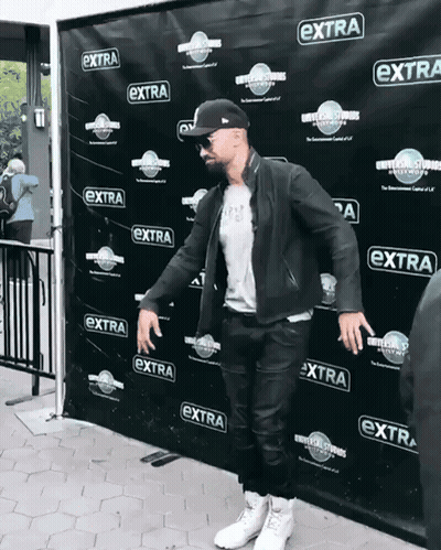 Man Standing In Front Of Extra Wall GIF