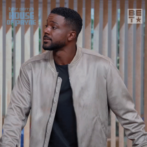 Man Standing In Front Of Fence With Tyler Perry's House Of Payne GIF