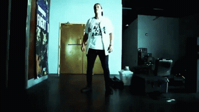 Man Standing In Front Of Fight Sign GIF
