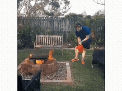 Man Standing In Front Of Fire Pit GIF