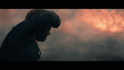 Man Standing In Front Of Fire With Fist GIF