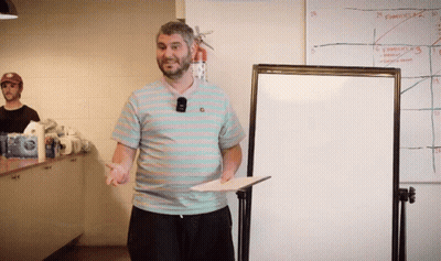 Man Standing In Front Of Funny Whiteboard GIF