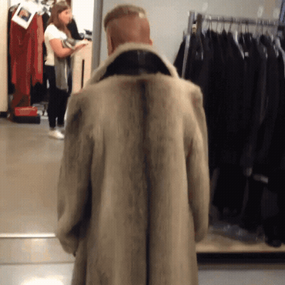 Man Standing In Front Of Fur Coat GIF