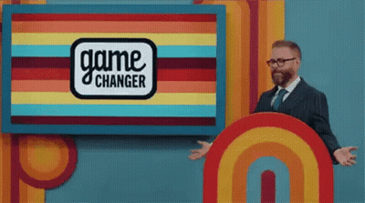 Man Standing In Front Of Game Changer Sign GIF