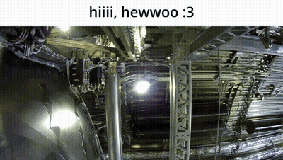 Man Standing In Front Of Garage Full Of Cars GIF