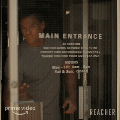 Man Standing In Front Of Glass Door Saying Main Entrance GIF