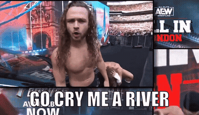 Man Standing In Front Of Go Cry Me A River Now Sign GIF