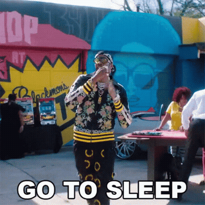 Man Standing In Front Of Go To Sleep Building GIF