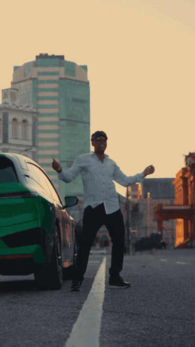 Man Standing In Front Of Green Car GIF
