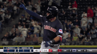 Man Standing In Front Of Guardians Sign On Baseball Field GIF
