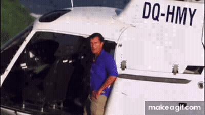 Man Standing In Front Of Helicopter DQ-HMY GIF