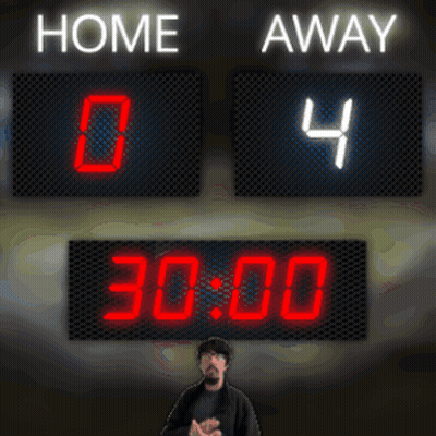 Man Standing In Front Of Home And Away Scoreboard GIF
