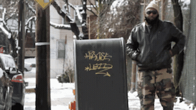 Man Standing In Front Of House Sign GIF