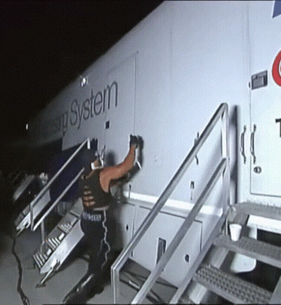 Man Standing in Front of Housing System Trailer