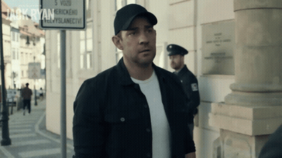 Man Standing In Front Of Jack Ryan Sign GIF