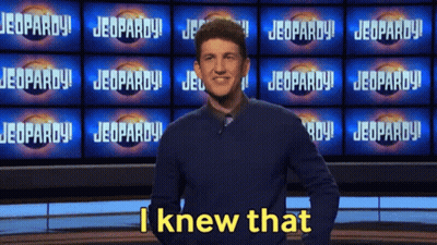Man Standing in Front of Jeopardy Screen