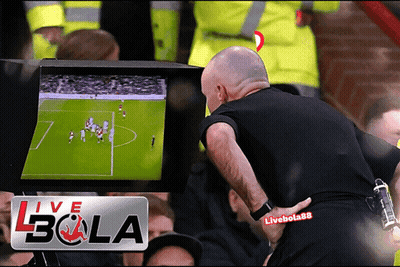 Man Standing In Front Of Live Bola Screen GIF