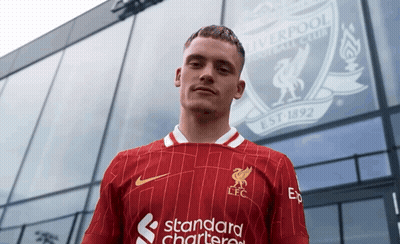 Man Standing In Front Of Liverpool Building GIF